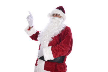 Side view of a senior man in traditional Santa Claus costume pointing with one hand with the other on his belly. Isolated on white.