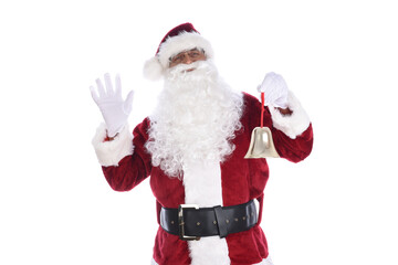 Senior man in traditional Santa Claus costume holding a gold bell ornament in one hand and waving with the other. Isolated on white.
