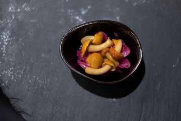 Marinated mushrooms with pink onions - small savory food serving