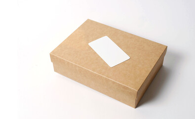 Cardboard craft box with cover on white background top view. The concept of delivery, mail, destinations, the quarantine period is relevant. Copy space.