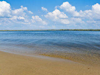 sandy river coast under a cloudy sky