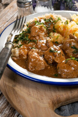 Minced meat balls in mushroom sauce.