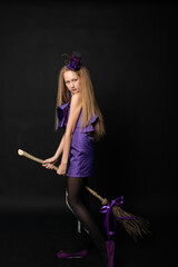 Teenage girl on black background of Halloween