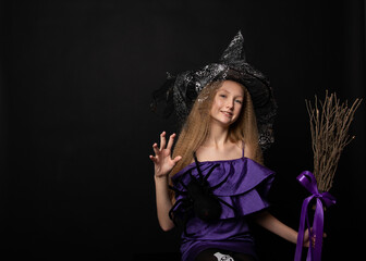 Teenage girl on black background of Halloween