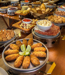 bread, cheese and savory buffet on a wooden table