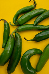 Green chili on a yellow background
