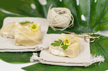 handmade soap made from squeezing soap slivers, the concept of spa and self-care at home, a gift made with your own hands