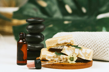 handmade soap made from squeezing soap slivers, pyramid of stones and oil, the concept of spa and self-care at home