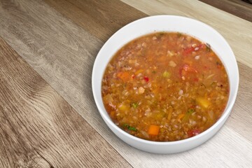 Bowl of delicious vegetable soup on a table