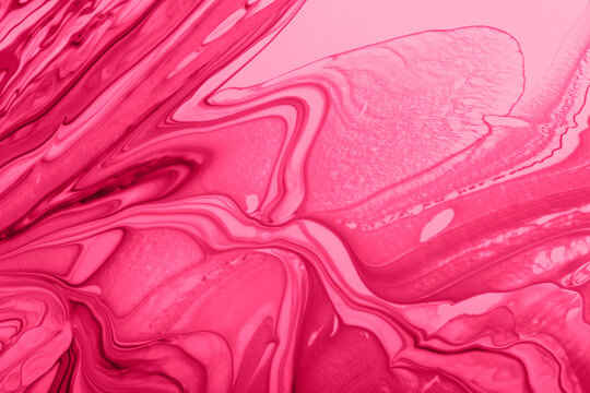 Monochrome pink marble background.Mixed nail polishes,make up concept.Beautiful stains of liquid nail laquers.Fluid art,pour painting technique.Horizontal banner,can be used as backdrop for chat.