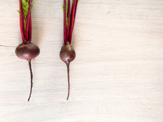 Fresh beautiful washed beets on a light background
