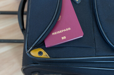 german passport on a suitcase
