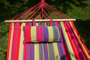 empty hammock in a green bright garden.