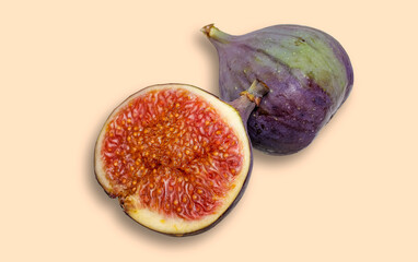 Ripe figs with shade isolated on a beige background.