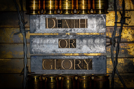 Death Or Glory text message on lead bars between copper 50 caliber gun casings surrounded by barbed wire on vintage textured grunge copper and gold background