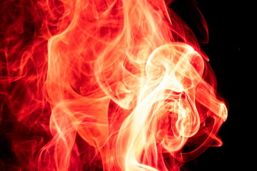 Red smoke on black background