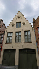 Roofs And Windows Of Old Authentic Brick Houses In Bruges, Belgium
