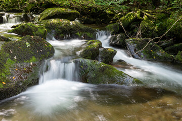 Long exposure of a waterfall on the Hoar Oak Water river at Watersmeet in Exmoor National Park