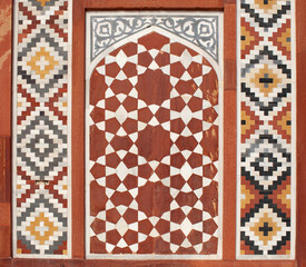 Details of colorful marble surface with stone inlay of the Tomb of Akbar the Great in Sikandra near Agra, Uttar Pradesh, India