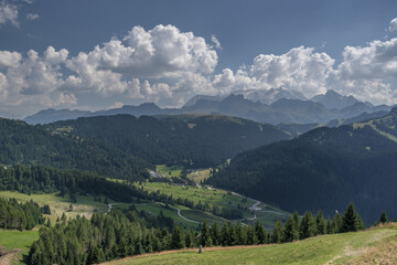 Fototapeta na wymiar View of the magnificent Dolomite mountains as seen from Piz La Ila plateau above La Villa village in Badia valley, Dolomites, South Tirol, Italy. 