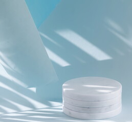 Marble podium and palm leaves shadows on blue background. Empty showcase for cosmetic product...