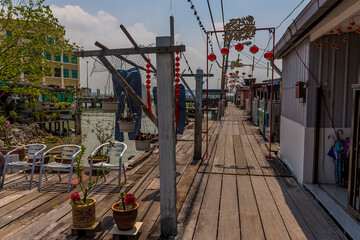 Naklejka premium Boardwalks stretch seaward on the clan jetties in George Town, Penang Island, Malaysia, Asia