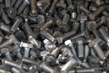 A scattering of steel bolts. Background. Texture.