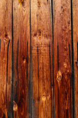 Naklejka premium Burnt pine wood texture. Barn plank background. Old wooden house interior panel. Brown timber with black coal structure. Grunge floor design. Rough weathered structure
