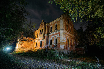Dark and creepy old abandoned haunted mansion at night. Former Karl von Meck house
