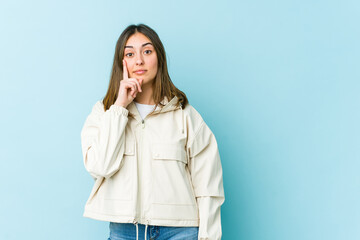 Young caucasian woman showing number one with finger.