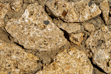 Factural background of the Turkish wall, limestone, macro photo. It is formed by sedimentary rocks. Ability to insert a large piece of text