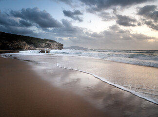 Cloudy sunset over Funtanazza Seashore in Sardinia