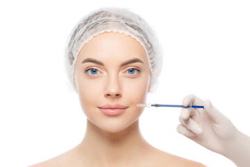 Close-up portrait of young female wearing medical cap, getting ready for filler injection to eliminate aging effect, isolated on white background