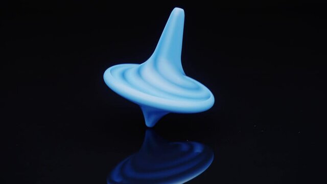Close up shot of a plastic spinning top moving.