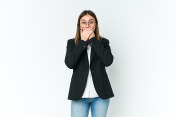 Young caucasian business woman shocked covering mouth with hands.