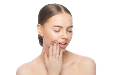Young woman suffering from toothache, pressing hand to jaw trying to overcome tooth pain, isolated...