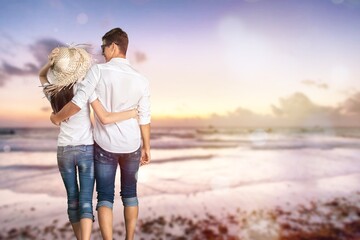 Lovely happy couple hugging on the seacoast background