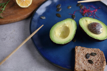 Avocado and whole wheat bread on kithcen table. Food photography ,cooking concept