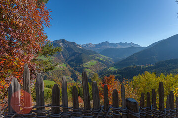 Autumn panorama of the Tires Valley with Catinaccio peaks profile in the background, Italy. Concept: autumnal Dolomite landscapes