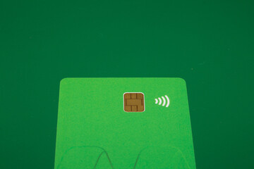 blank card with brown square chip symbol and a WiFi symbol concept of contactless payment as new...