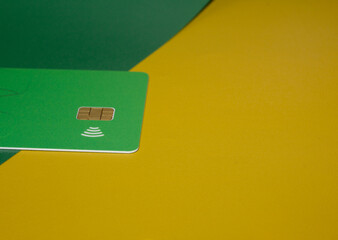 blank card with brown square chip symbol and a WiFi symbol concept of contactless payment as new...