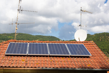 solar panels and antennas on the roof of a house - 385845856