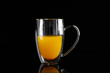  medicinal sea buckthorn tea on a black background