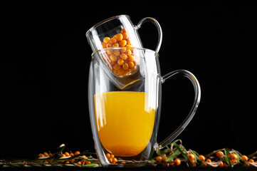  medicinal sea buckthorn tea on a black background