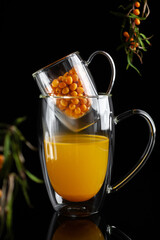  medicinal sea buckthorn tea on a black background