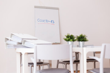 Coronavirus concept. Bright color office with a lot of unfinished paper work due to covid-19.