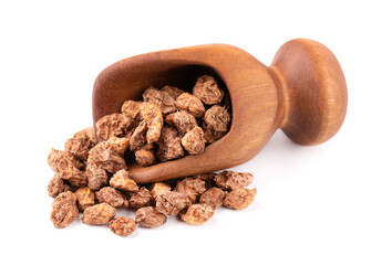 Tigernuts isolated on white background. Chufa nuts or tiger nuts in wooden scoop.