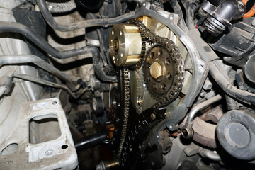 The engine of a modern car during repairs. Elements of the timing mechanism.