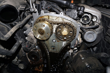 The engine of a modern car during repairs. Elements of the timing mechanism.