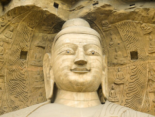 Fototapeta na wymiar Giant Buddha sculture in Yungang grottoes near Datong